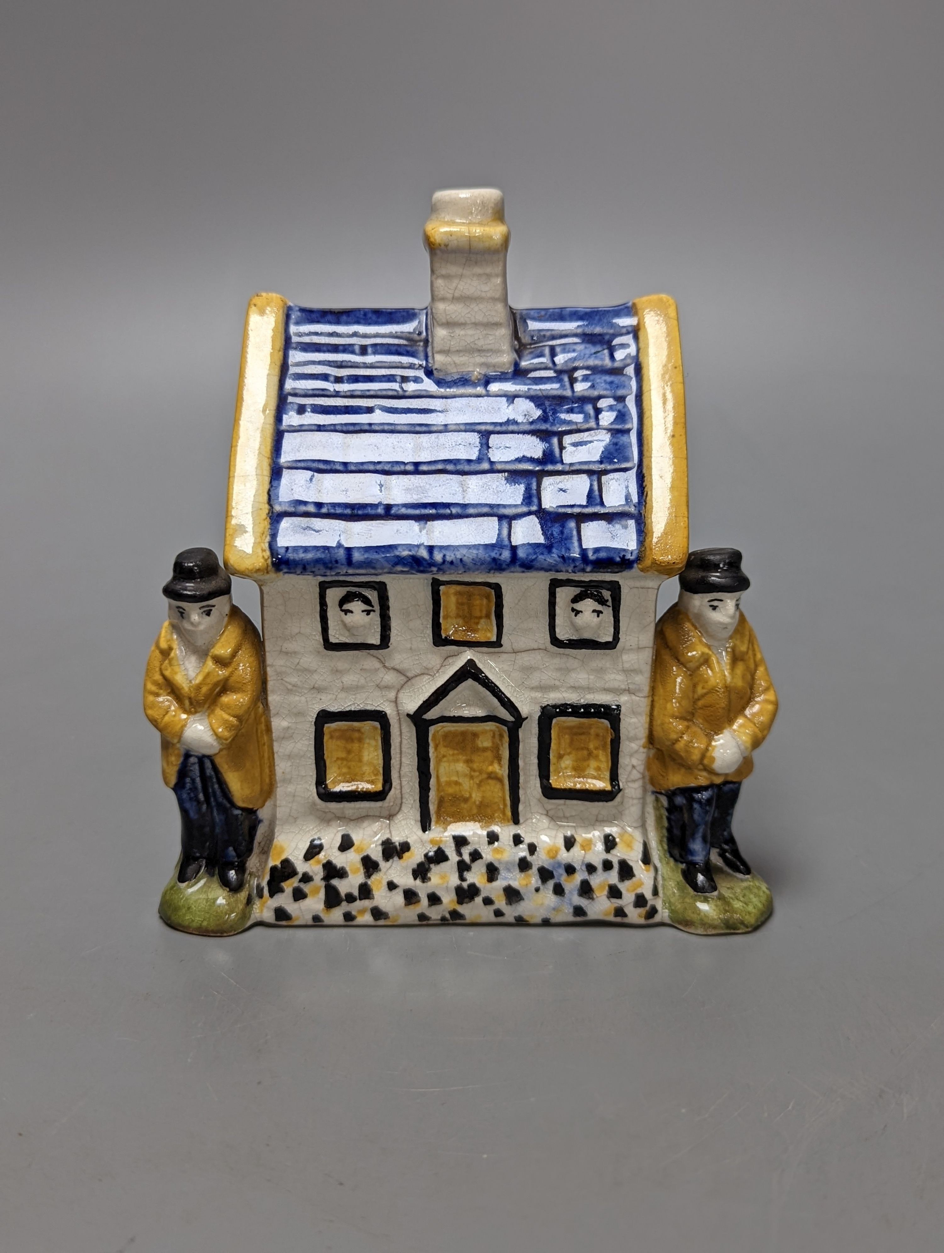 A Staffordshire Prattware money box, c.1810, and another later example (2) both 12.5cm, faults